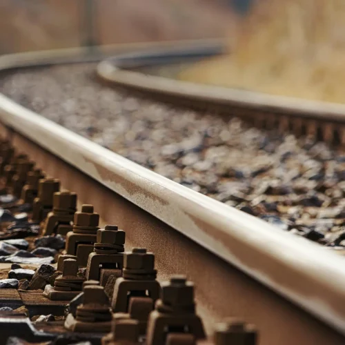 Detailed shot of a rusty railway track, showcasing close-up textures and metallic elements.